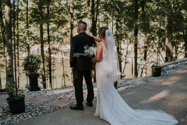 Bride and father walk