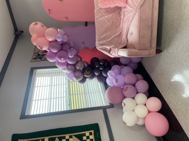 Purple butterfly birthday balloon setup